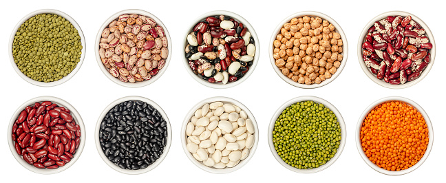 Set of different legumes in bowl isolated on white background with clipping path.