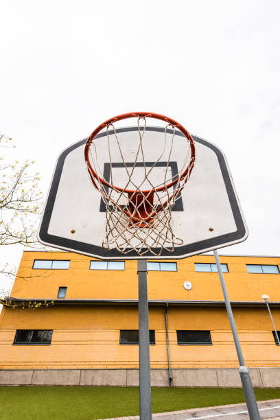 istock Basket hoop on a school yard.. 1328390875