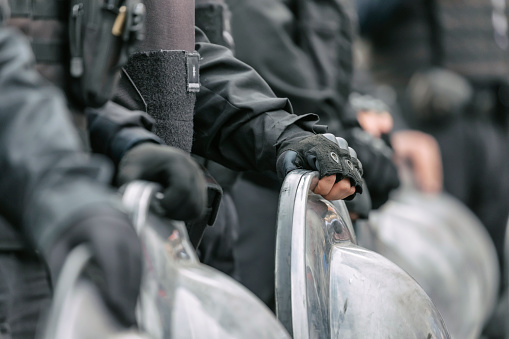 Police officers in armored clothing on duty during street protest