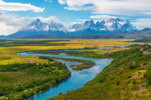 Torres del Paine and Cuernos del Paine peaks with Serrano river in spring, Torres del Paine national park, Patagonia, Chile.