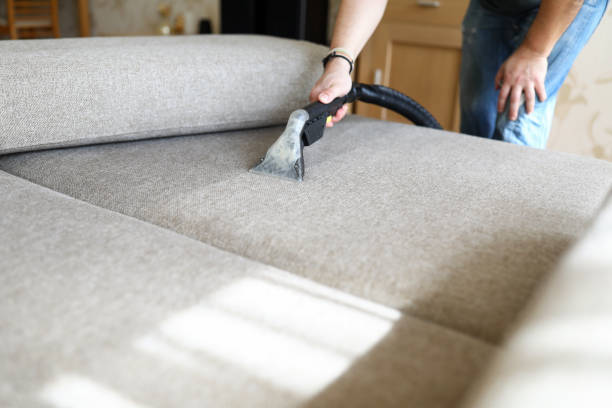 istock Hoovering sofa with vapor cleaning service at home 1328392990