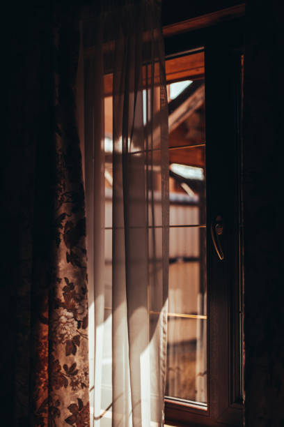 istock Daylight shining from the street through the window 1328394939