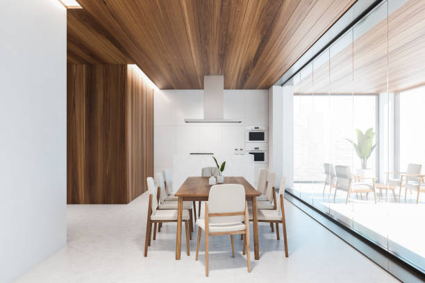 istock Wooden and white kitchen interior with table and counters 1328396050