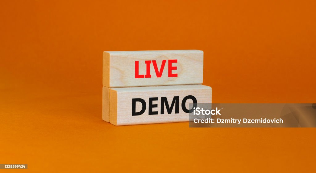 Live demo symbol. Concept words 'live demo' on wooden blocks on a beautiful orange background. Copy space. Business and live demo concept. Protest Stock Photo