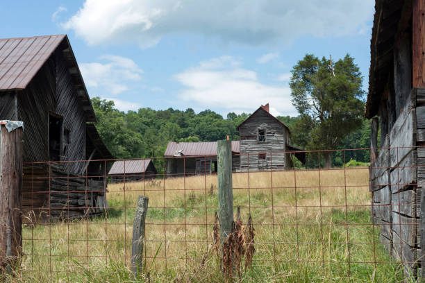 istock Old farmstead with wire fencing 1328401478