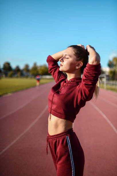 istock Athletic Female In Tracksuit Ready For Running Track Training Session 1328403695