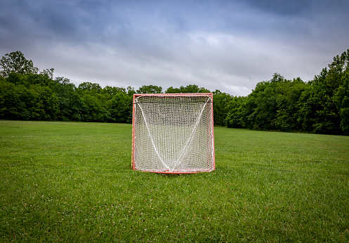 Panorama of a lawn field with lacrosse goals stored and locked together in Veteran's park in Lexington, KY USA during early morning hours