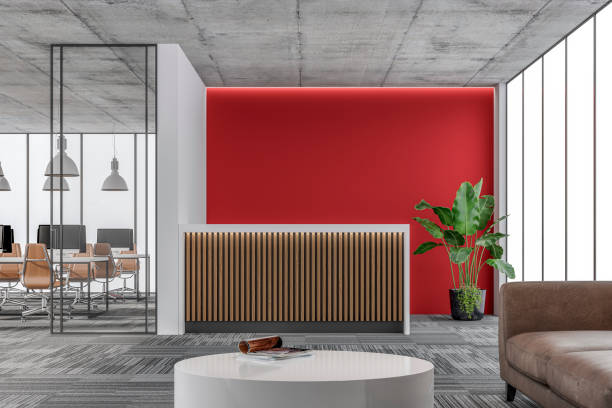 istock Large office interior: a reception desk, a lounge corner with copy space and wordesks behind glass door 1328404693