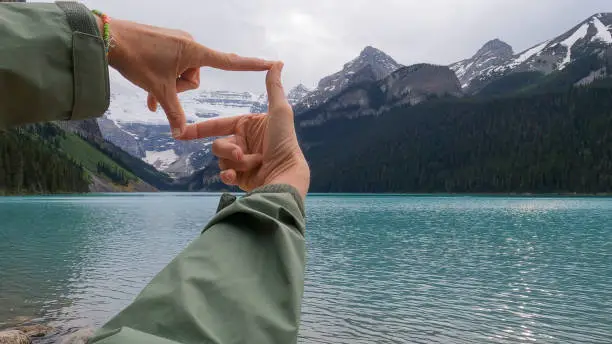 Photo of Scenic view of woman's hands, conceptually capturing Lake Louise