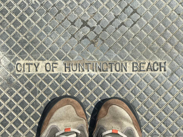 istock Huntington Beach California sign with feet 1328413036