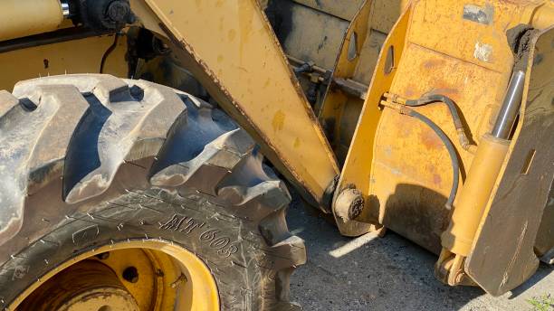 istock excavator teeth road repair water pipe 1328419589
