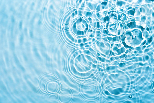 istock Abstract transparent liquid background with concentric circles and ripples. Spa concept. Soft focus 1328419809