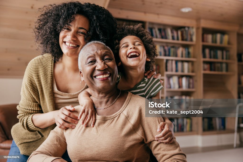 Assisted living lifestyle Family members taking care of grandmother Family Stock Photo