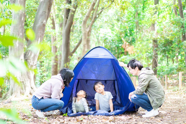 istock Family camping in the forest 1328421514