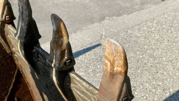 istock excavator teeth road repair water pipe 1328423264