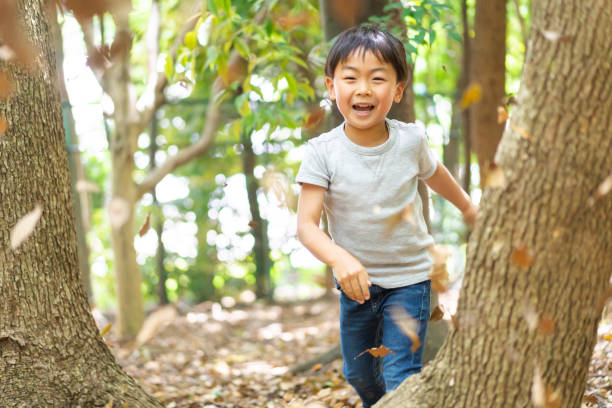 Little boy playing in the mountains