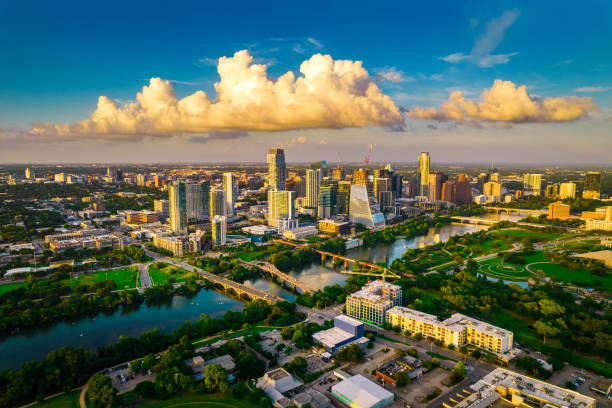 Perfect Golden Hour Cityscape view high above Austin Texas Skyline Golden Hour Austin Texas Skyline a Perfect view of the gorgeous Texas Capital City with Cumulus Cloud over the Cityscape and perfect reflection off Town Lake austin texas photos stock pictures, royalty-free photos & images