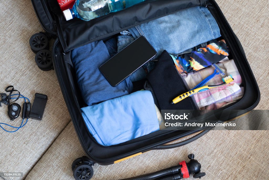 preparing for the trip, collecting things Carry-On Luggage Stock Photo