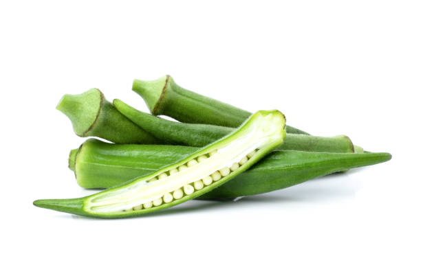 istock Fresh okra with slice isolated on white 1328432650