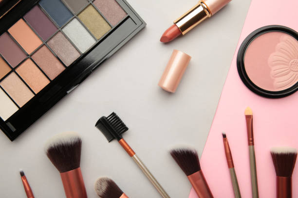 istock Different luxury makeup products on colorful background, flat lay 1328436071