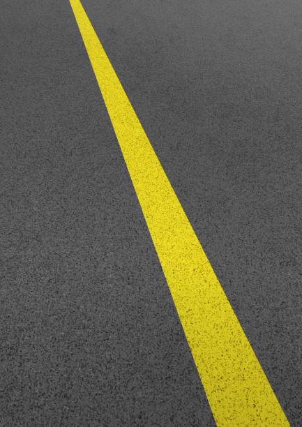 istock Illustration of a roadway with yellow lines 1328438091
