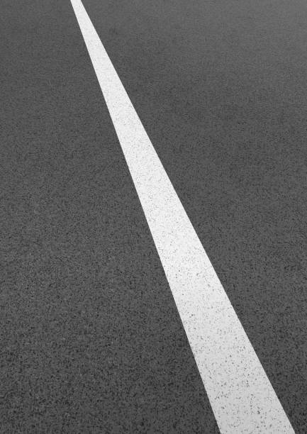 istock Illustration of a roadway with a white line 1328438103