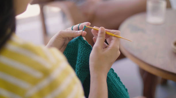 istock Woman Crocheting with green yarn. 1328442889