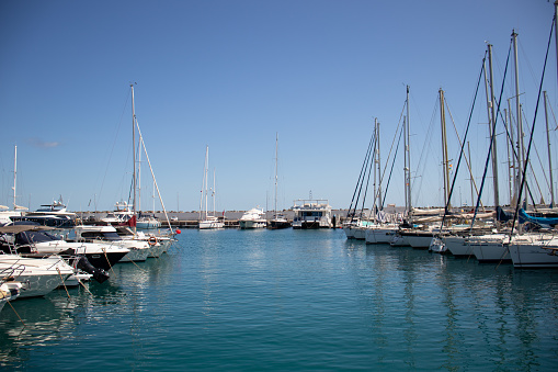 General view of the Pasito Blanco marina, in Gran Canaria, with boats on both sides.