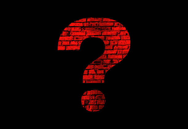 istock Illustration of a red question mark with a brick texture on a black background. 1328450530