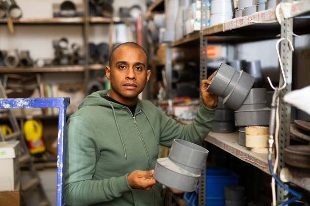 istock Hispanic man looking for construction supplies in building hypermarket 1328451555