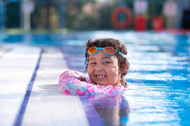 istock Child girl swimming. 1328451845