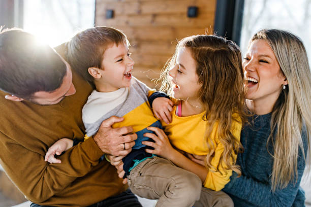 istock Cheerful family having fun while playing in the living room. 1328452997