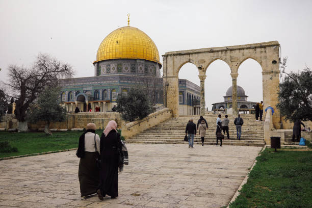 Jerusalem Dome of the Rock Jerusalem, Israel - 03 24 2018: Palestinian people walking at Dome of the Rock temple mosque Jerusalem old city. al aksa mosque stock pictures, royalty-free photos & images