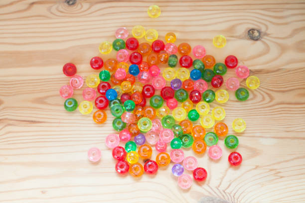 A macro image of a pile of colourful beads