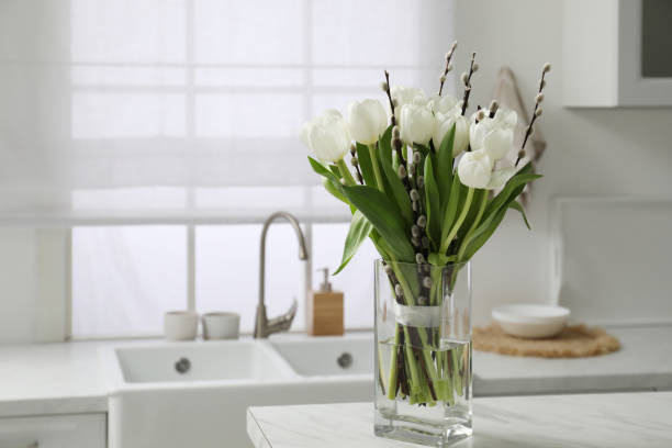 beautiful bouquet of willow branches and tulips in vase on white table indoors, space for text - tulip vase flower spring imagens e fotografias de stock