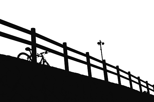 Bicycle leaning against the fence