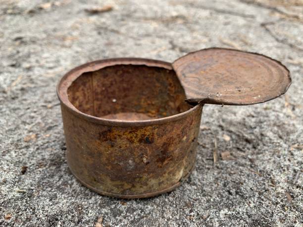 istock Rusty open tin can. An old iron can of canned food. 1328460612