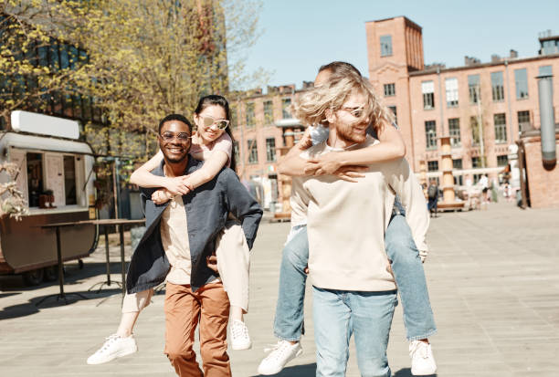 istock Young Couples in Summer City 1328460642