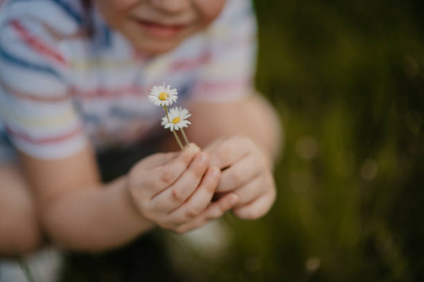 istock The little boy enjoys nature 1328461366