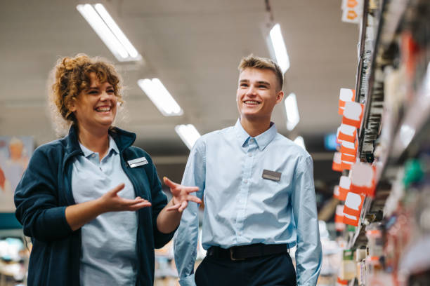 istock Supermarket manager training young employee 1328464038