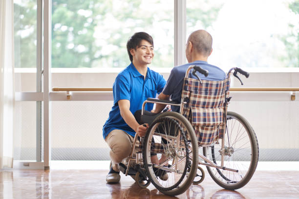 istock Wheelchair-riding elderly and caregivers 1328465261