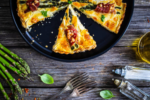 istock Tart with asparagus and serrano ham on wooden table 1328468112