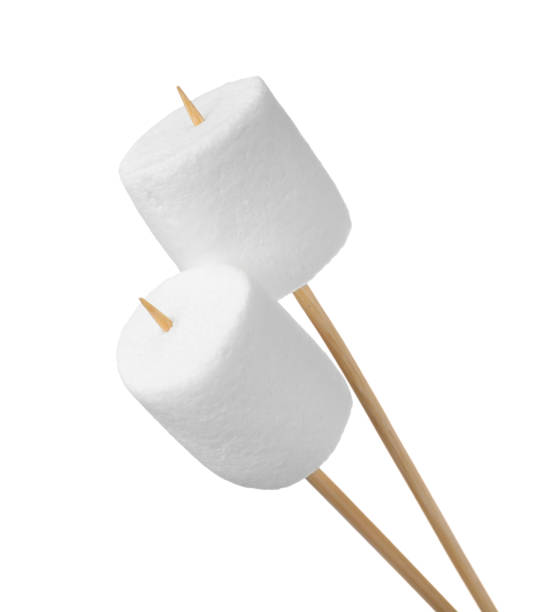istock Sticks with delicious puffy marshmallows on white background 1328469591