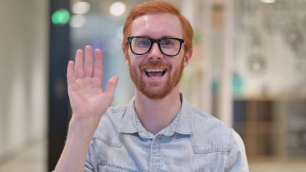 istock Beautiful Young Redhead Man doing Video Chat 1328471715