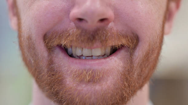 istock Mouth of Redhead Man Smiling at the Camera 1328472282