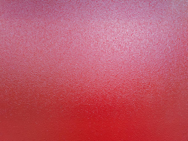 background of red shagreen powder paint coating on flat sheet steel surface
