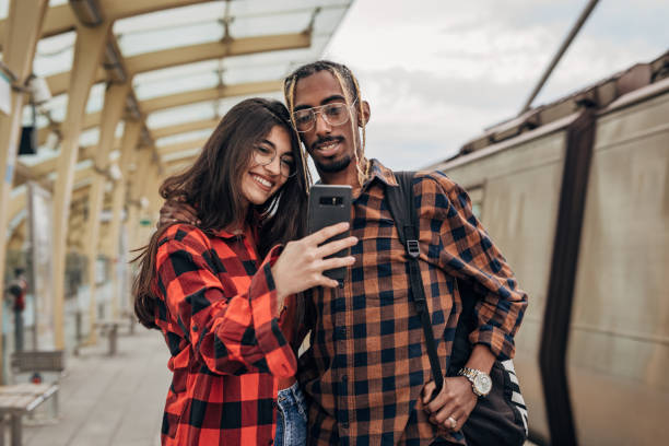 istock Young couple taking a selfie on subway station 1328474890