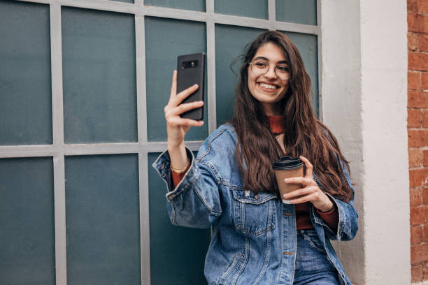 istock Young woman taking a selfie 1328475034