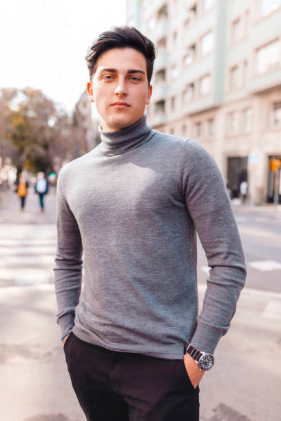 istock Young man looking at camera on the street 1328476435