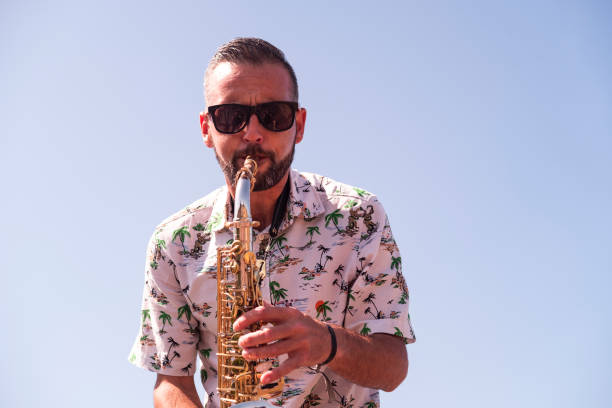Saxophone player in extreme high-contrast style, iconic black-and-white poster look.